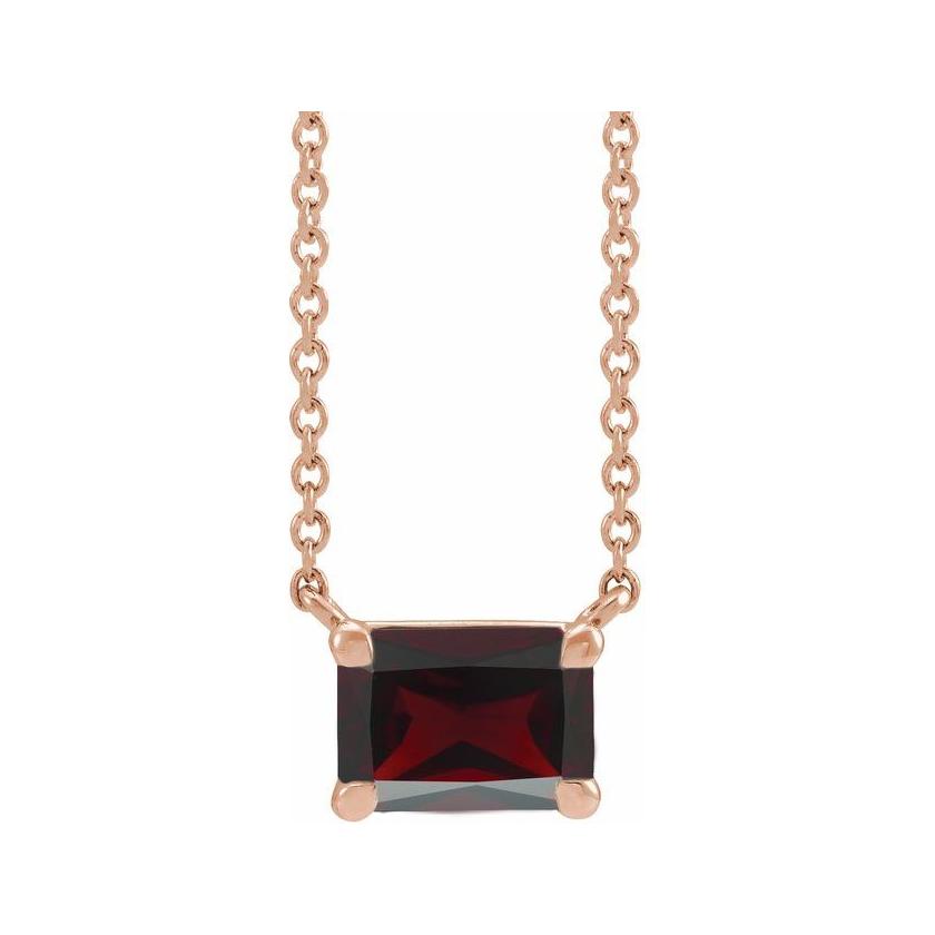 Emerald-cut garnet birthstone necklace set in 14K rose gold with vertical minimalist pendant design
