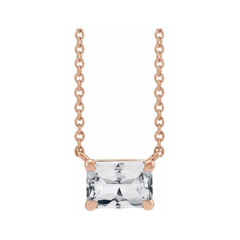 Emerald-cut white sapphire birthstone necklace set in 14K rose gold with vertical minimalist pendant design