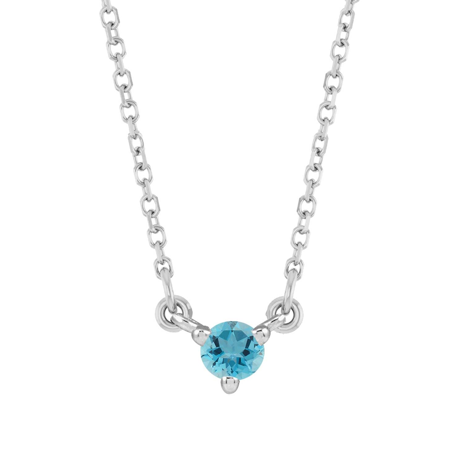 Tiny birthstone pendant in 14K white gold with a faceted zircon center for subtle sparkle.