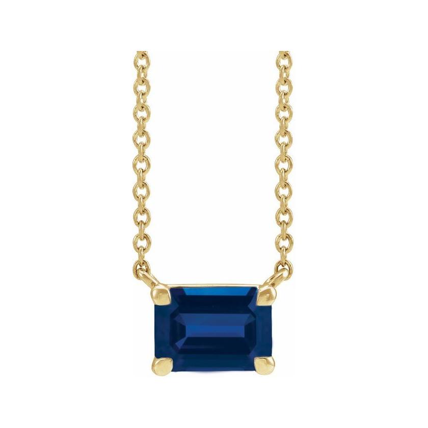 Modern 14K white gold necklace featuring vertical emerald-cut sapphire gemstone for birth month elegance