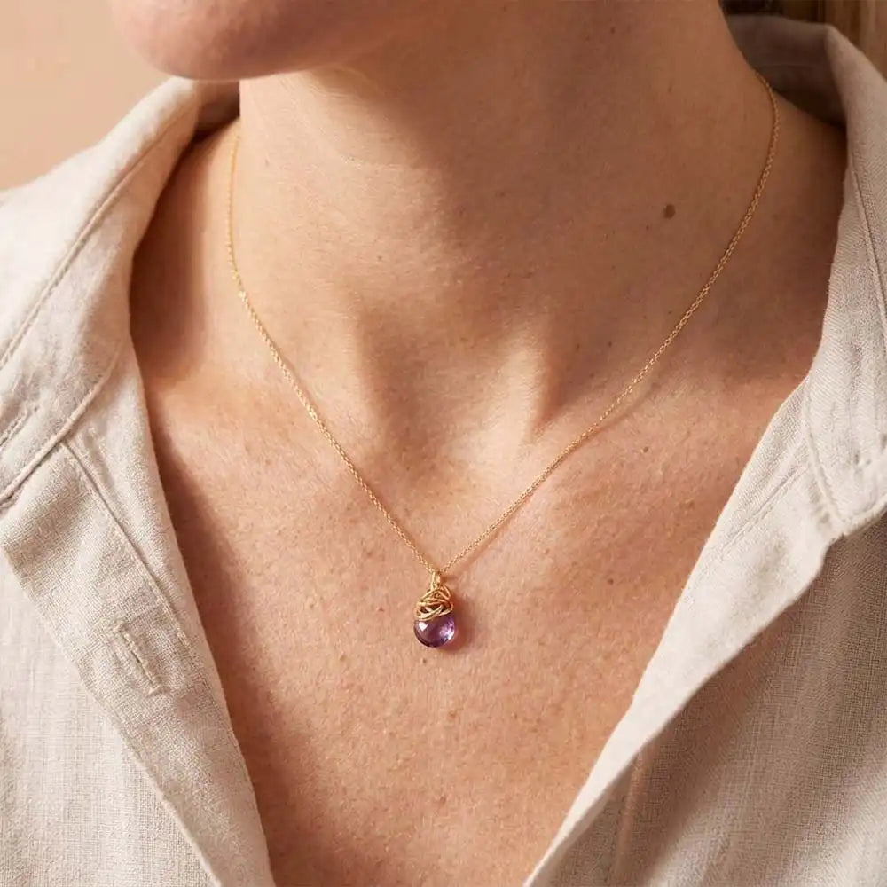 Natural amethyst pendant necklace in sterling silver, close-up of setting in gold-fill