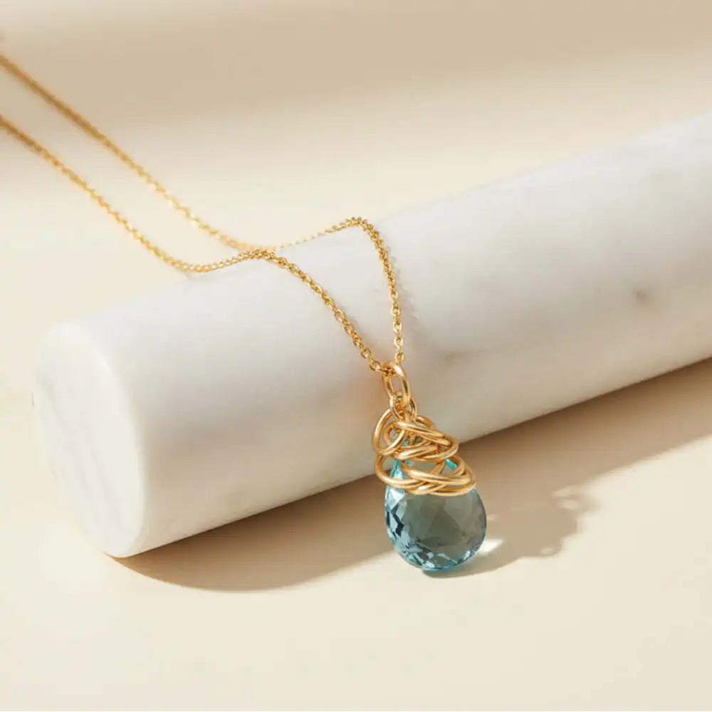 Natural aquamarine pendant necklace in sterling silver, styled on chain necklace