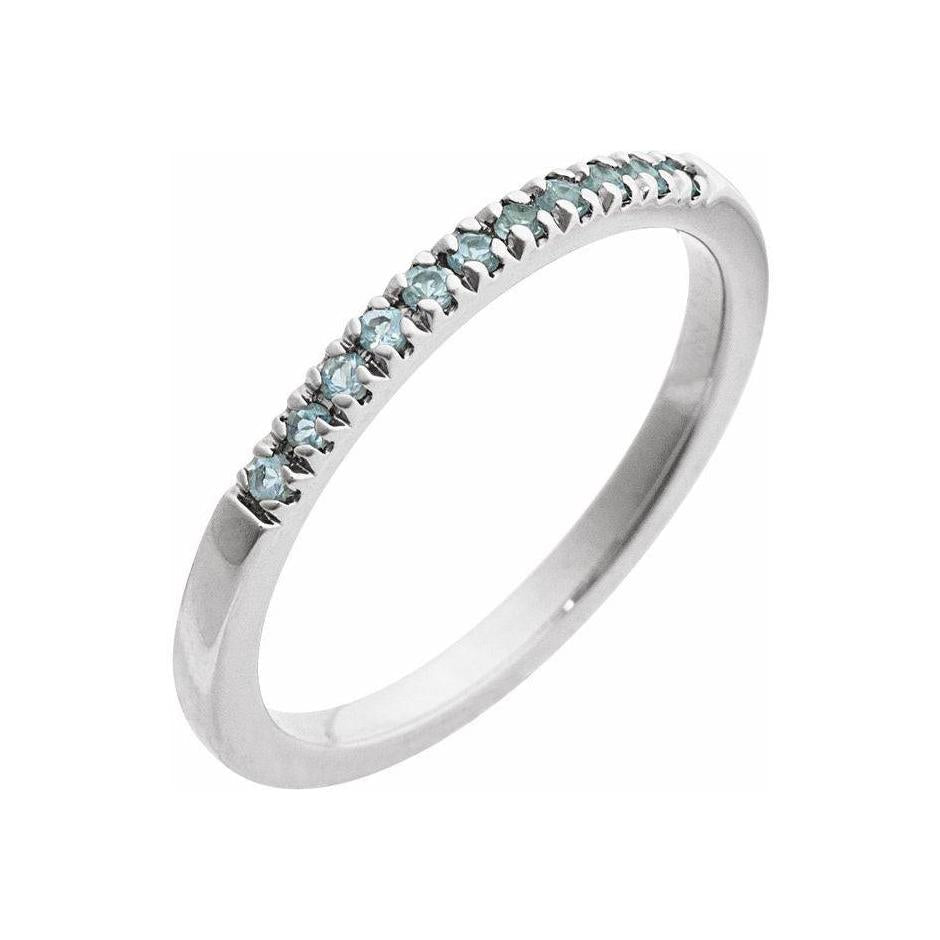 Handcrafted stackable ring in 14K white gold, adorned with a subtle aquamarine gem.