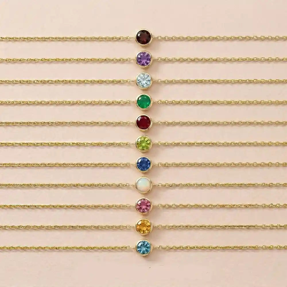 Bezel-set birthstone bracelets displayed together.