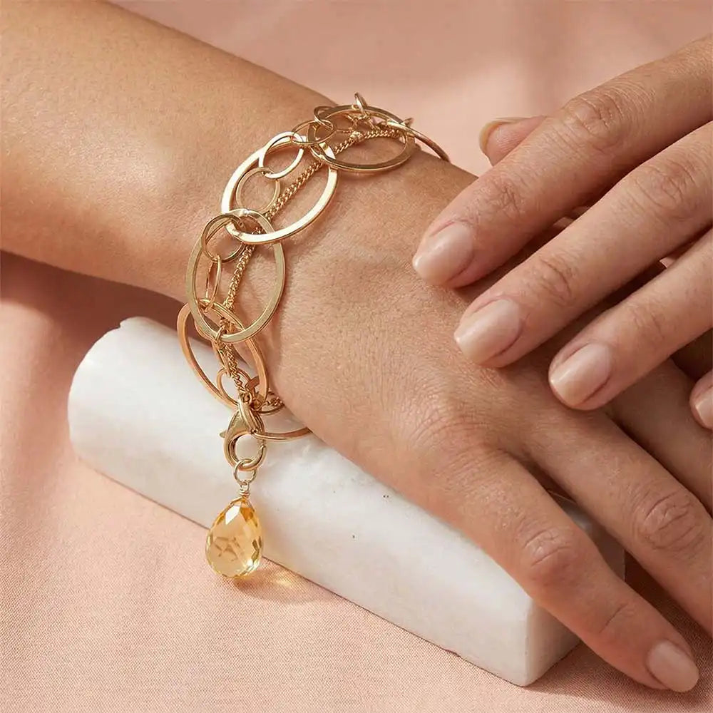 Natural citrine woven chain bracelet in sterling silver, close-up of setting in gold-fill variant--Gold-fill variant--Sterling-silver variant--Citrine