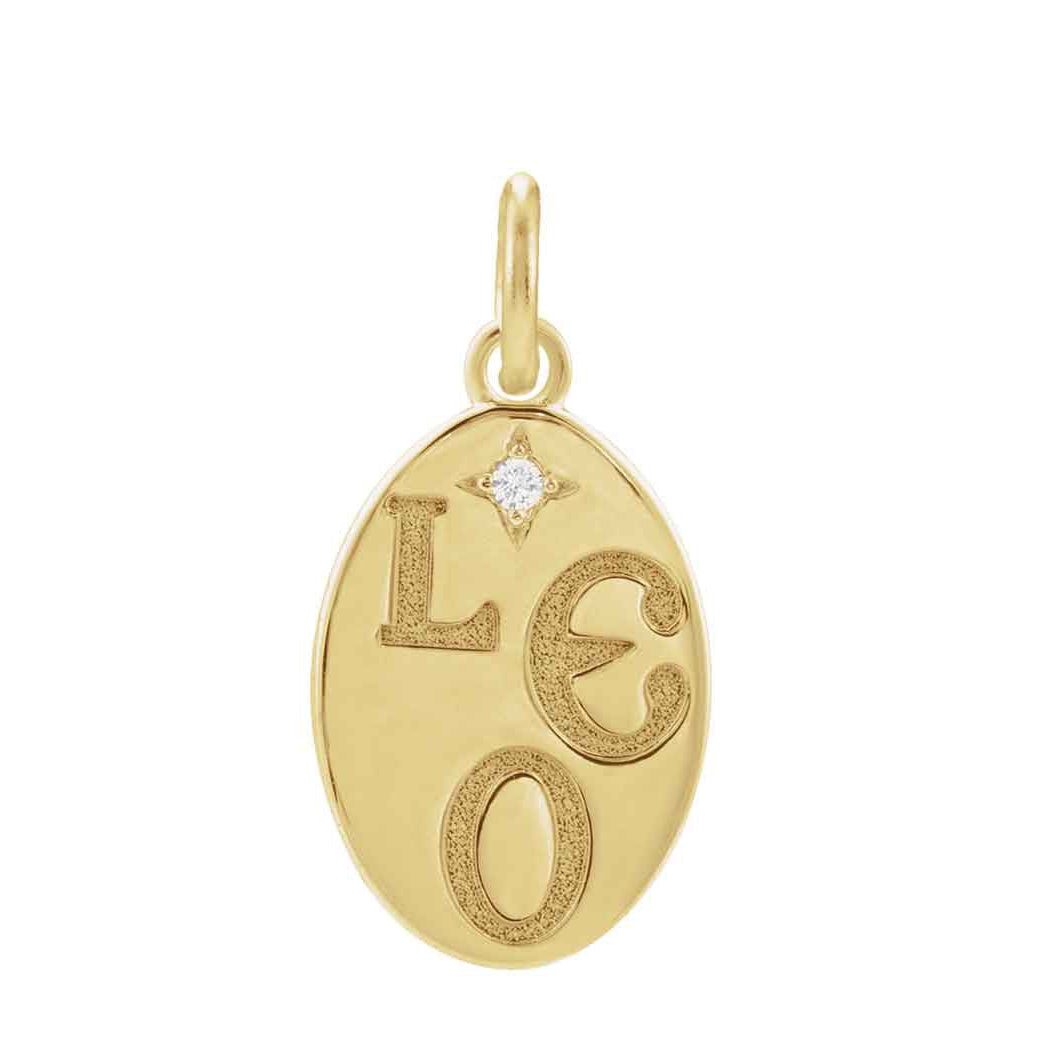 Hand-finished round zodiac charm in 14K yellow gold, engraved with the sign of Leo