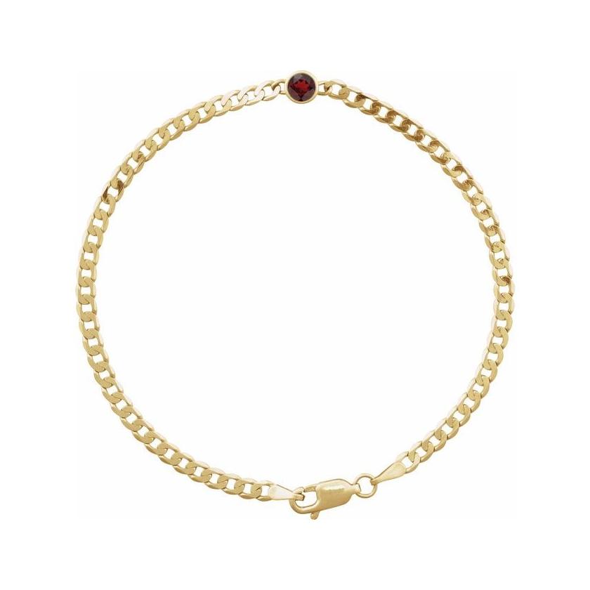 Minimalist bracelet in 14K gold with bezel-set garnet gemstone at the center.