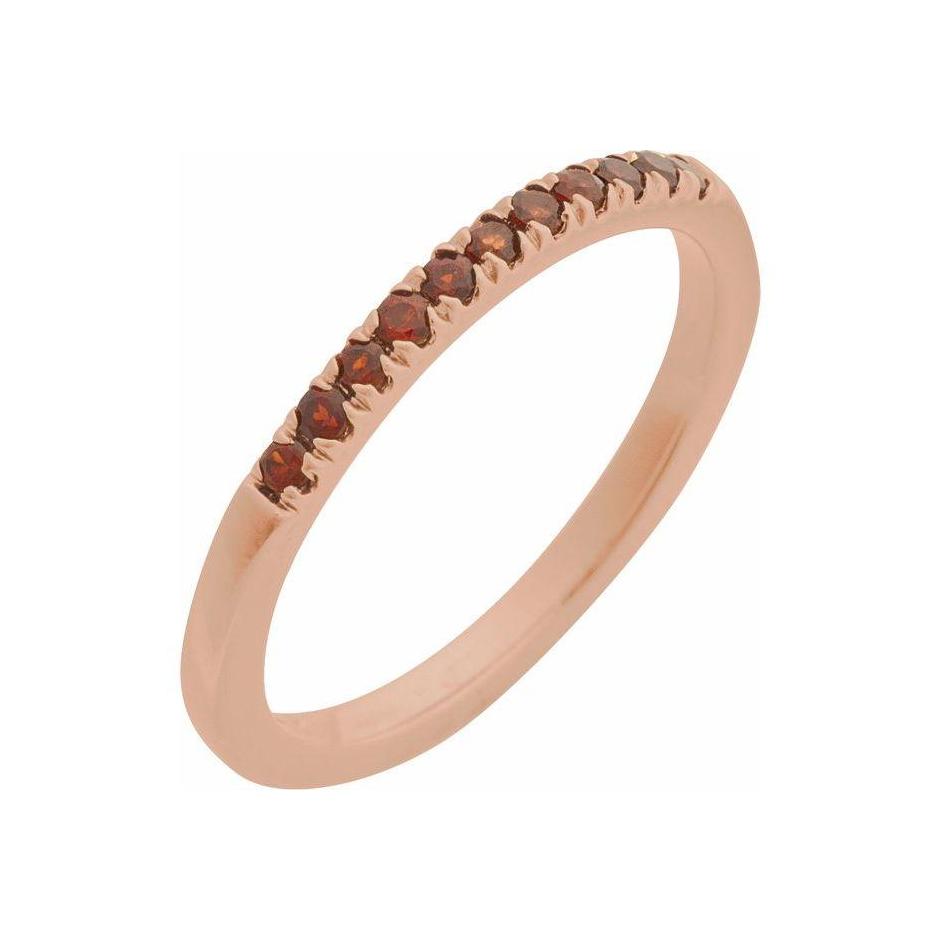 14K rose gold stacking band featuring a petite garnet gemstone for daily elegance.