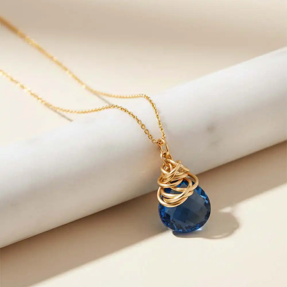 Natural london blue topaz pendant necklace in sterling silver, styled on chain necklace