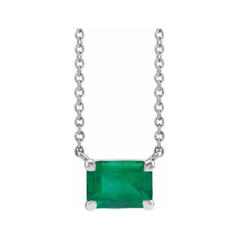 Handcrafted vertical emerald gemstone necklace in polished sterling silver—a modern birthstone keepsake