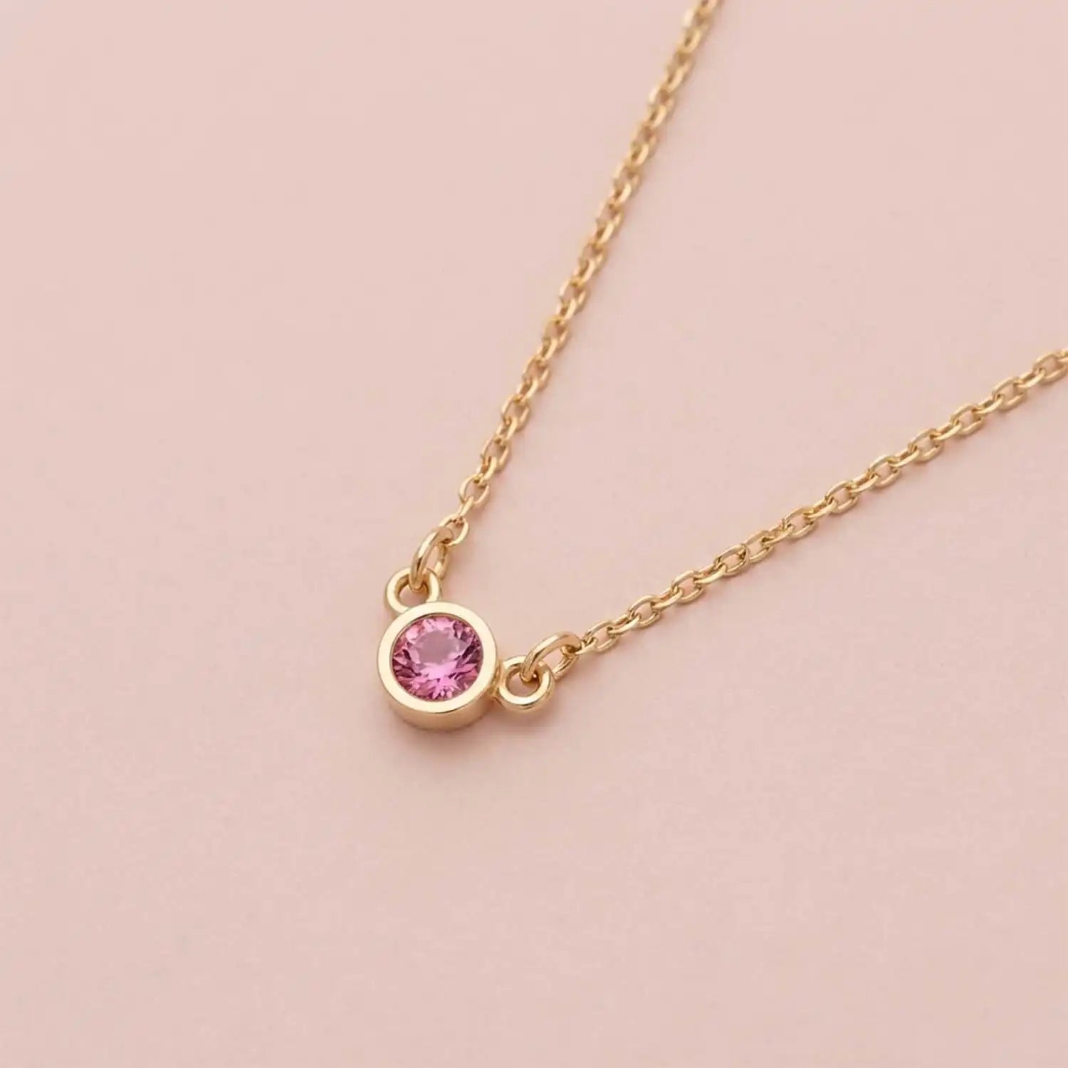 Bezel-set tourmaline birthstone necklace in 14K rose gold on cable chain variant--Sterling silver