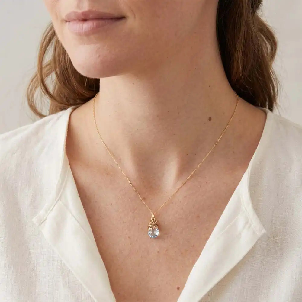 Natural white topaz pendant necklace in sterling silver, close-up of setting in gold-fill