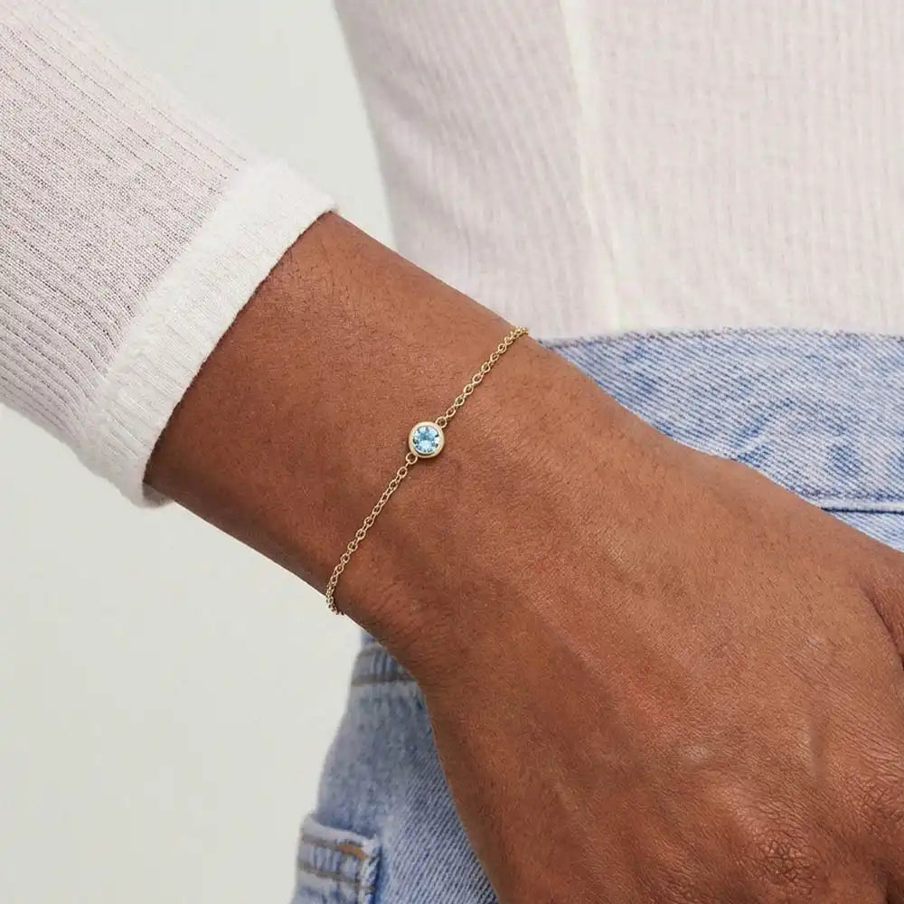 Model wearing bezel-set zircon bracelet variant--14K-yellow-gold variant--Zircon