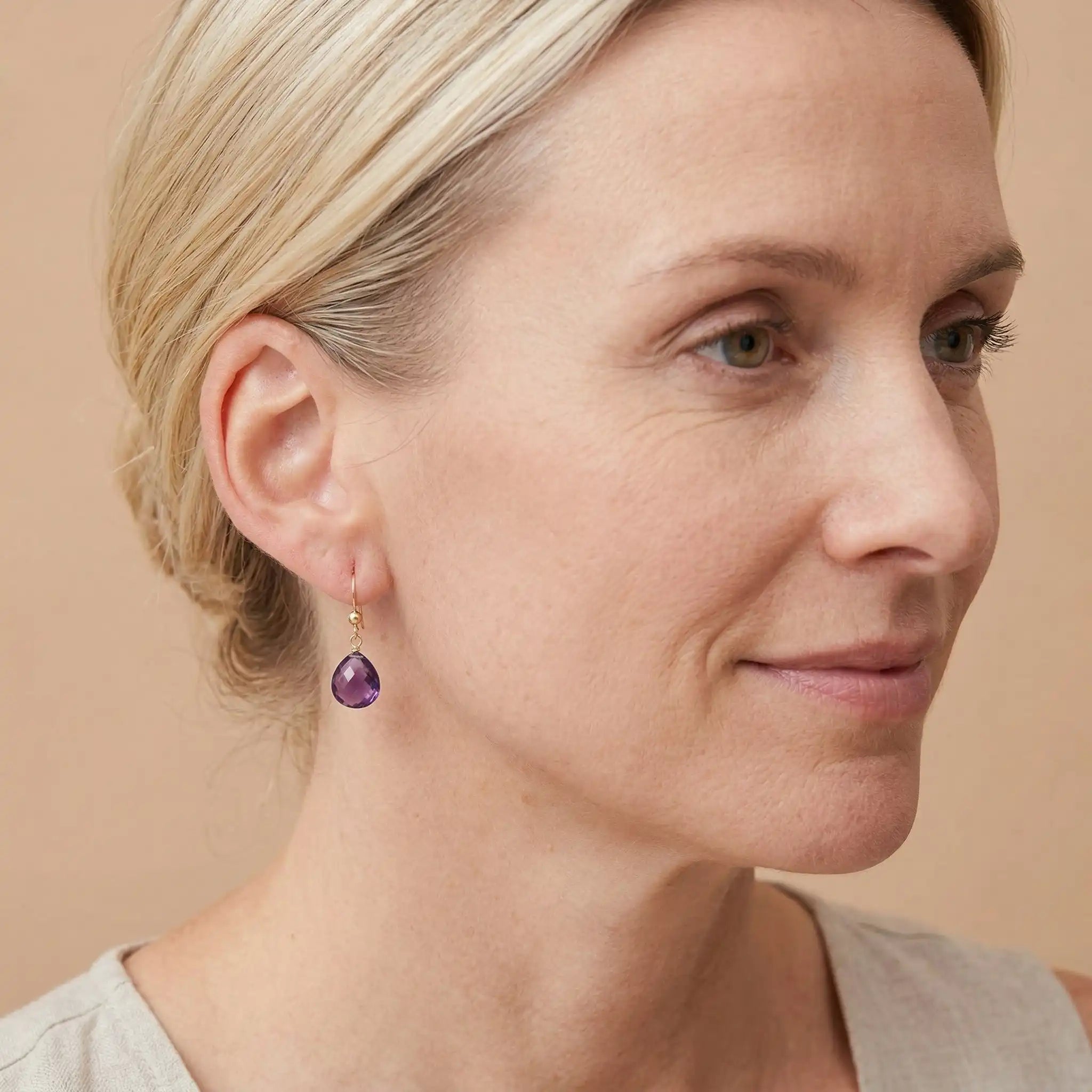 Drop earring in gold-fill shown on model variant--Gold-fill, variant--Sterling-silver, variant--14K-yellow-gold, variant--14K-white-gold variant--Amethyst