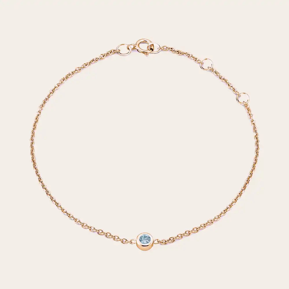 Bezel-set aquamarine bracelet in 14K rose gold, wrist close-up rose gold variant--14K-rose-gold variant--Aquamarine
