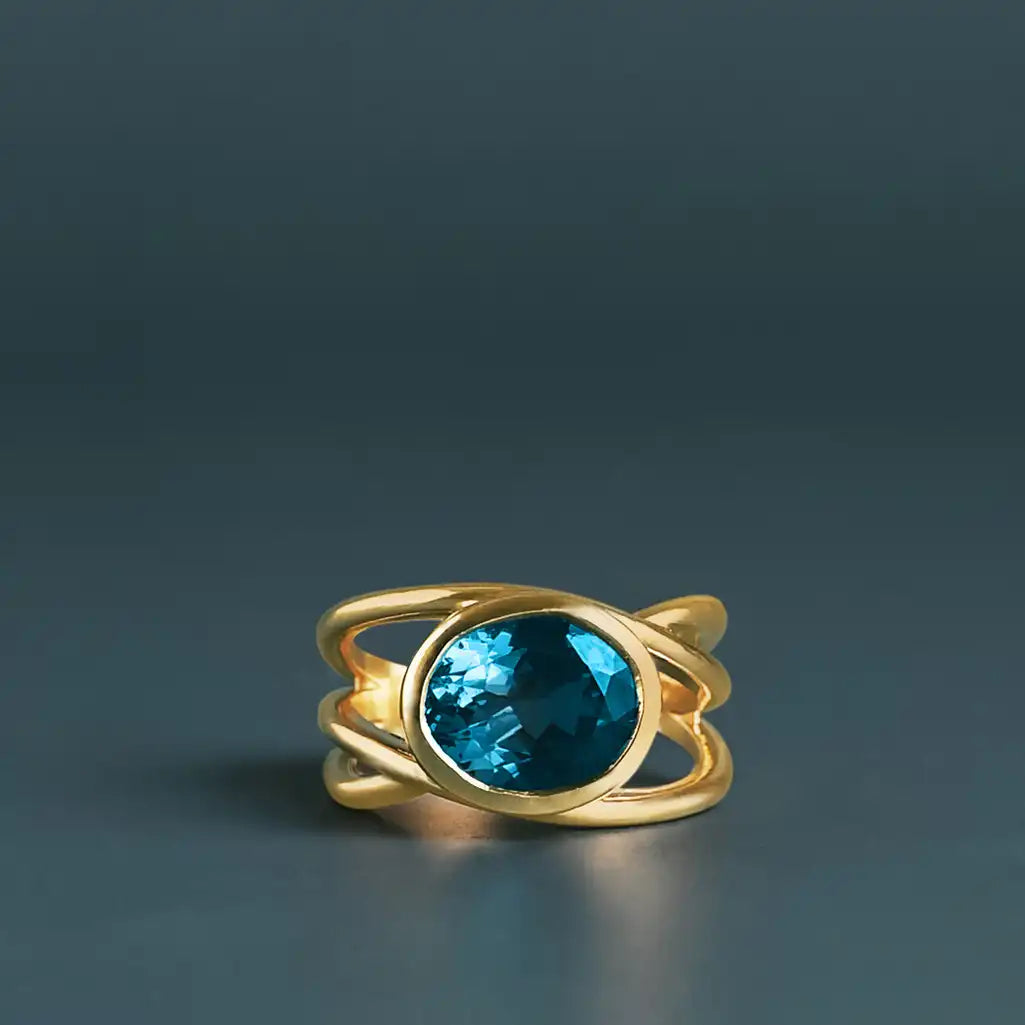Criss-cross London Blue Topaz cocktail ring in 10K gold