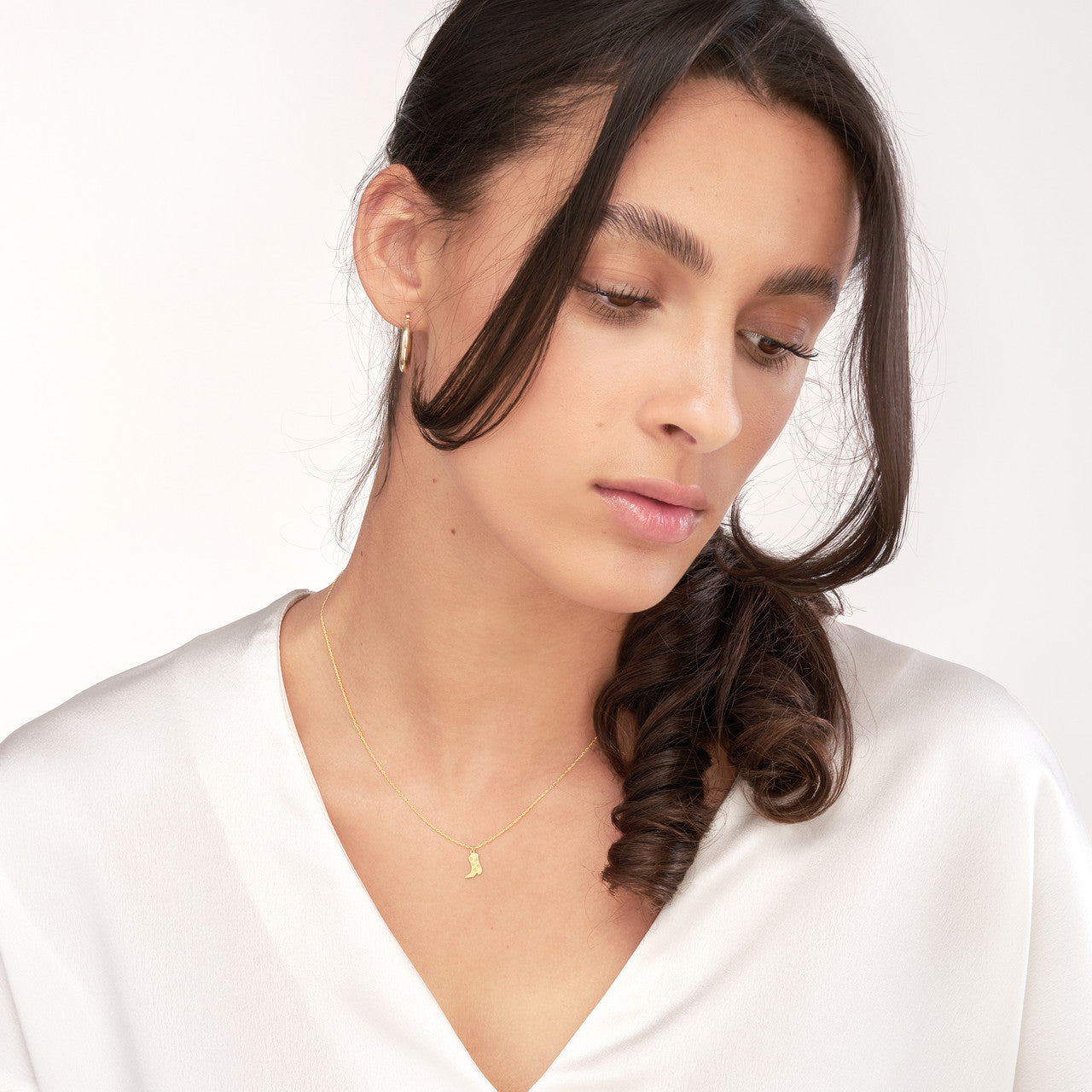 Cowboy Boot Necklace styled on model, layered with delicate chains for everyday minimalist Western look.