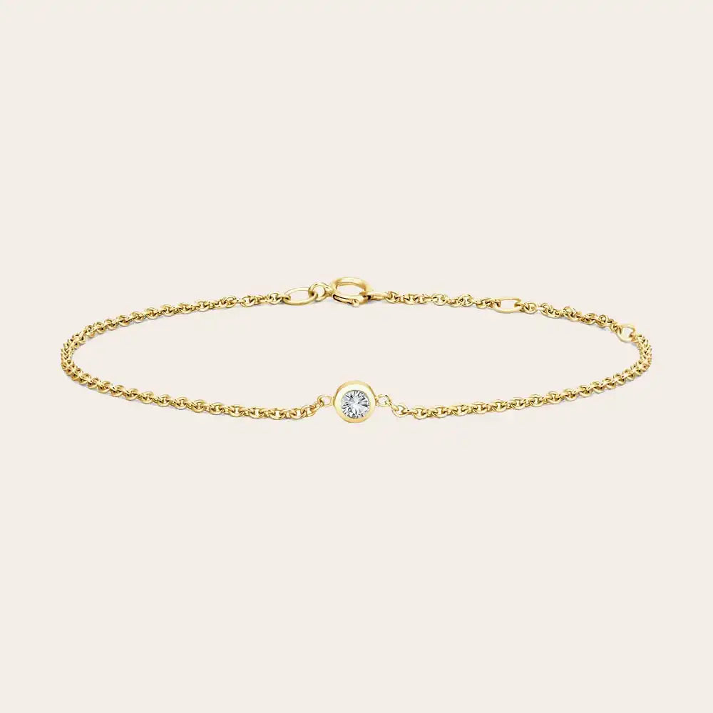 Bezel-set diamond bracelet flatlay showing clear stone on curb chain yellow gold variant--14K-yellow-gold variant--Diamond