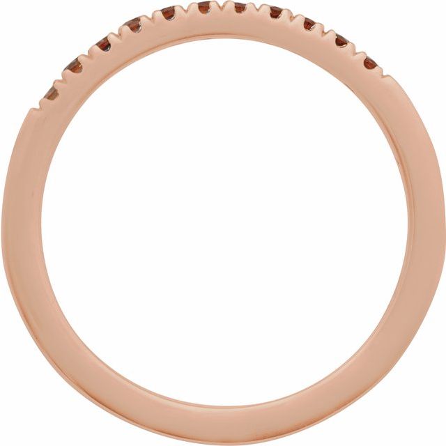 French-set garnet stacking band in rose gold detail view