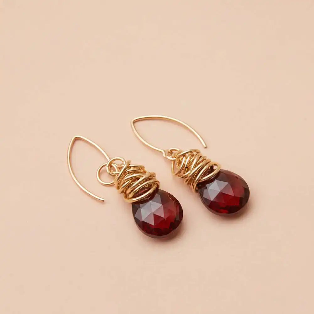 Garnet dangle earrings product shot, genuine deep red stone in sculptural bezel setting variant--Gold-fill variant--Sterling-silver variant--Garnet