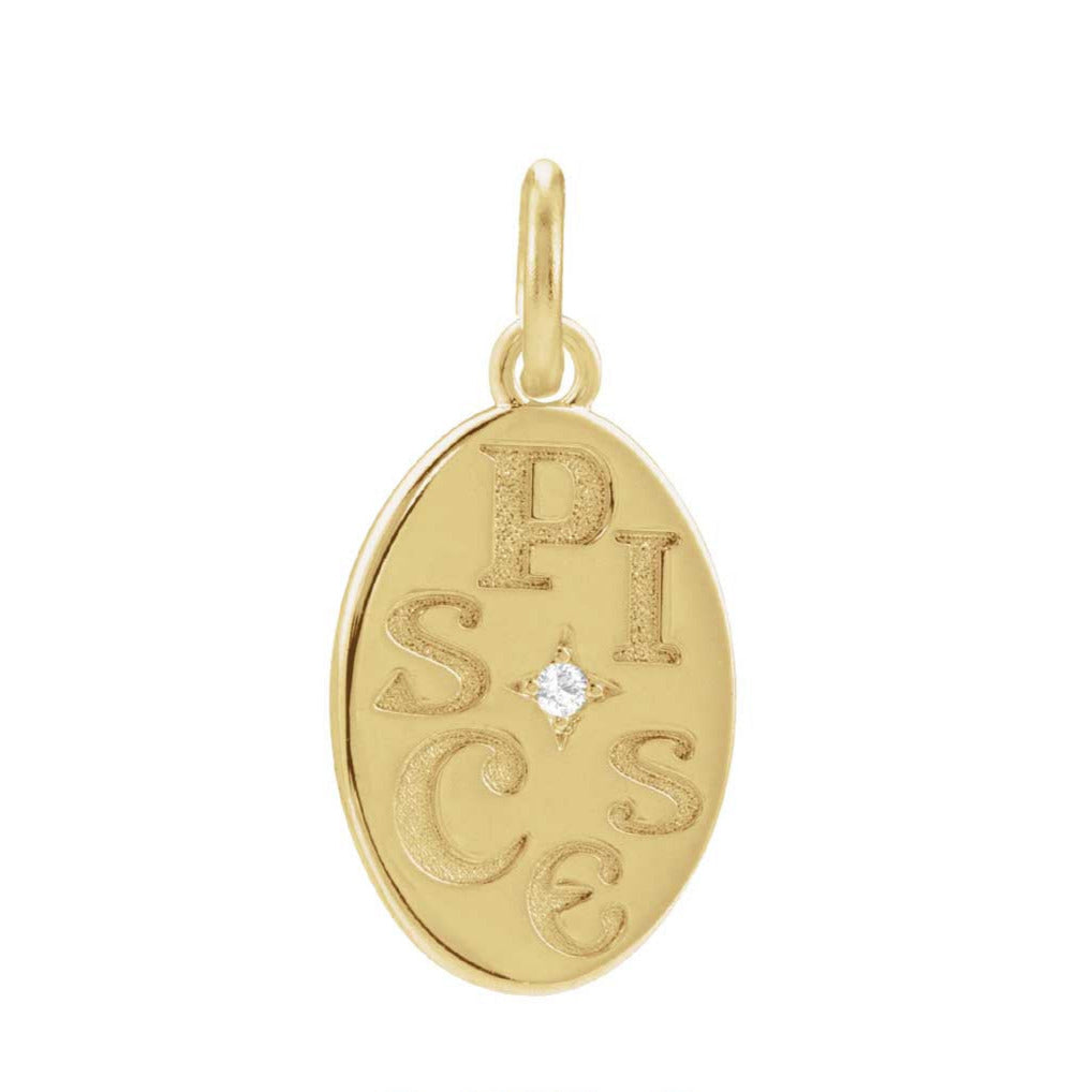 Pisces glyph hand-engraved on recycled gold charm