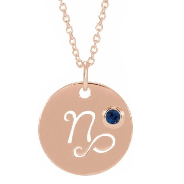 Capricorn zodiac necklace in 14K rose gold with coordinating birthstone accent charm.