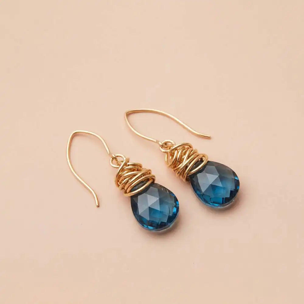 London blue topaz dangle earrings product shot, genuine deep blue stone in sculptural bezel setting variant--Gold-fill variant--Sterling-silver variant--London-Topaz