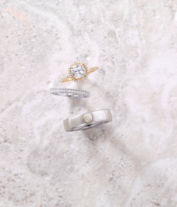 White gold milgrain band styled with mens band and engagement ring