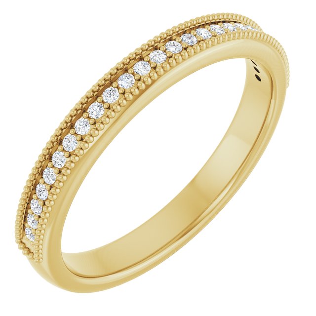 Angled view showing milgrain beading and four-prong diamond settings in yellow gold