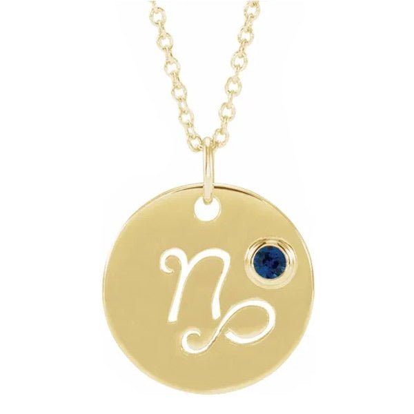 14K yellow gold zodiac charm necklace for Capricorn, paired with a natural gemstone.