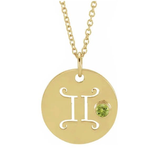 Dainty Gemini zodiac pendant and gemstone charm necklace in polished 14K yellow gold.