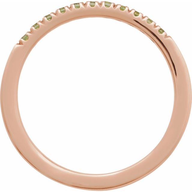 Side view of rose gold birthstone band with peridot
