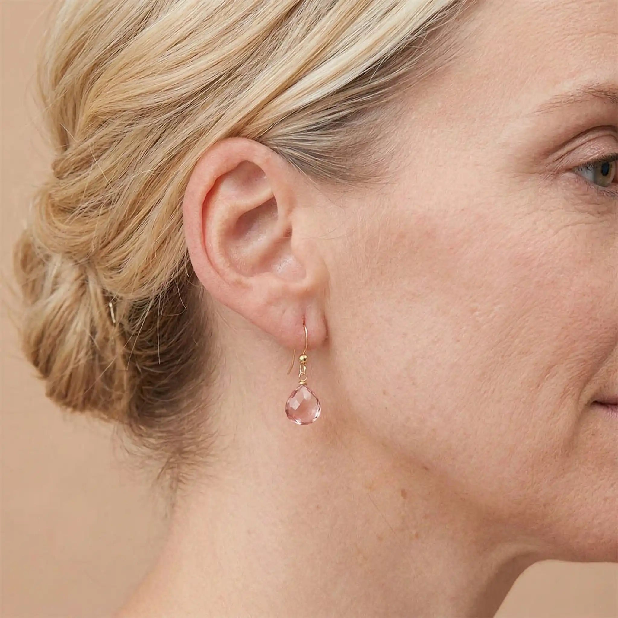 Drop earring in gold-fill shown on model. variant--Gold-fill, variant--Sterling-silver, variant--14K-yellow-gold, variant--14K-white-gold variant--Pink-Topaz