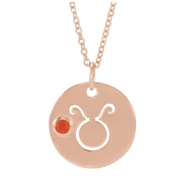 Taurus zodiac medallion in 14K rose gold with matching birthstone charm detail.