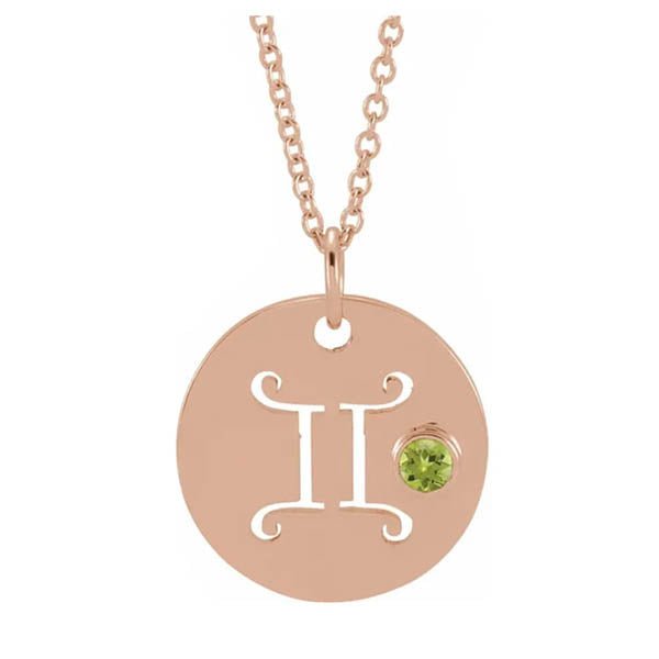 Gemini zodiac necklace in 14K rose gold with coordinating birthstone accent charm.