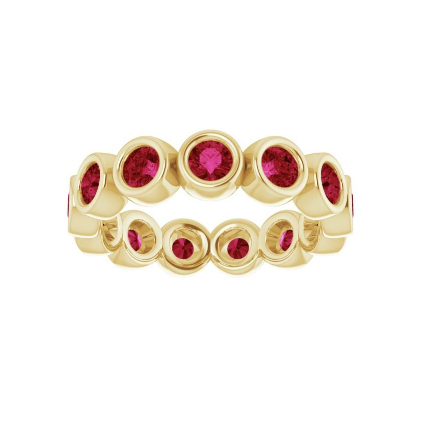 13 ruby gemstone eternity band featuring bezel settings and recycled gold