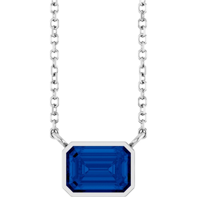 Emerald-cut sapphire solitaire necklace in white gold