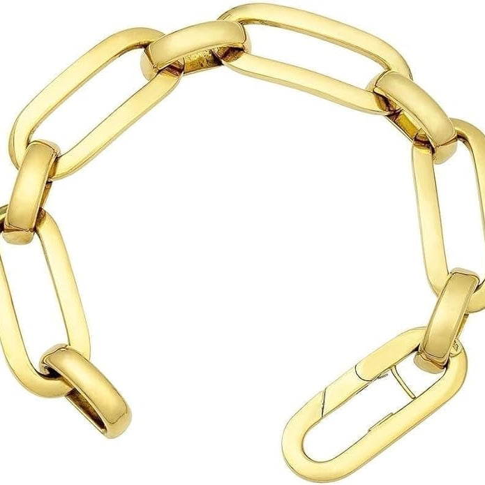 Elegant 18K yellow gold link bracelet stacked with bangles