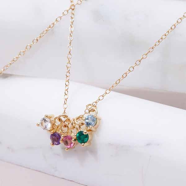 Birthstone charm styled on necklace