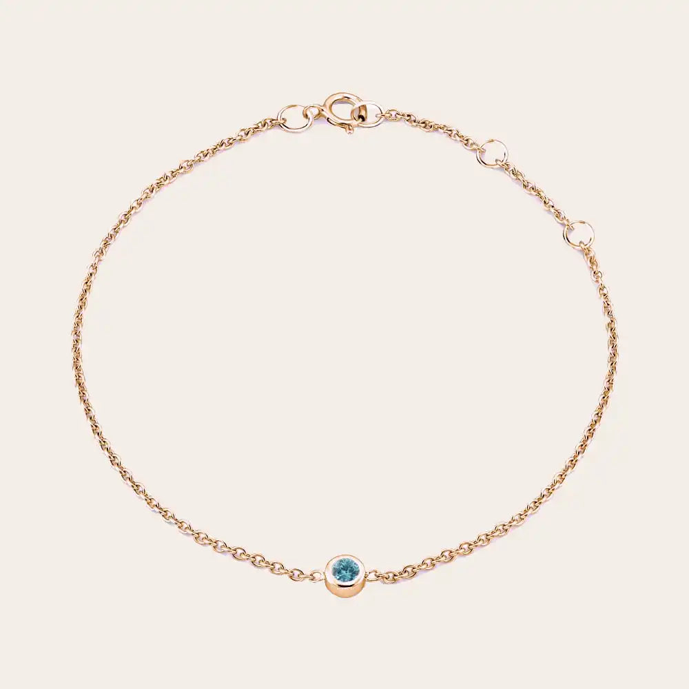 Bezel-set blue zircon bracelet in 14K rose gold, close-up of stone and setting rose gold variant--14K-rose-gold variant--Zircon