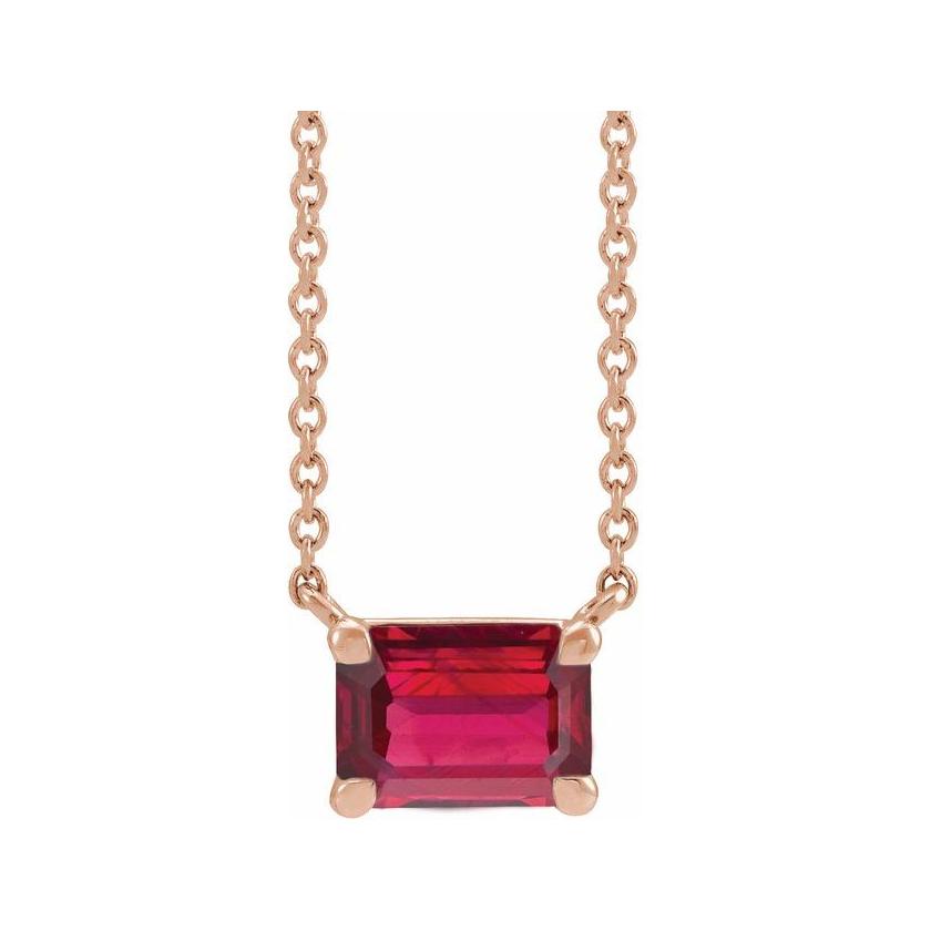 Minimalist 14K rose gold Ruby birthstone necklace featuring a 5x3mm emerald-cut pendant.