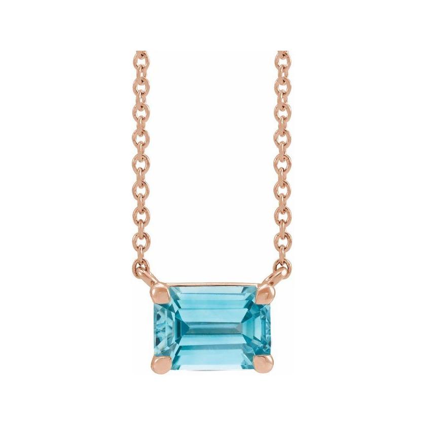 Minimalist 14K rose gold Zircon birthstone necklace featuring a 5x3mm emerald-cut pendant.