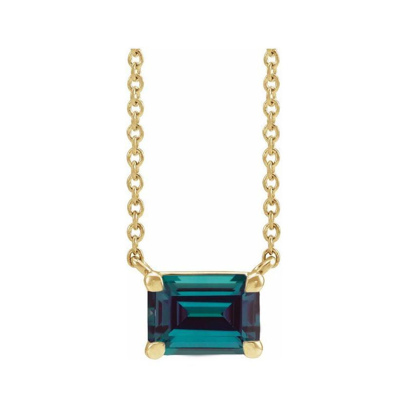 Minimalist 14K yellow gold Alexandrite birthstone necklace featuring a 5x3mm emerald-cut pendant.