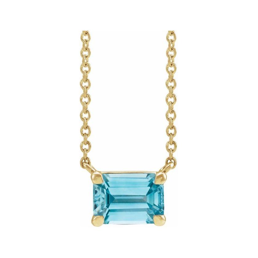 Minimalist 14K yellow gold Zircon birthstone necklace featuring a 5x3mm emerald-cut pendant.