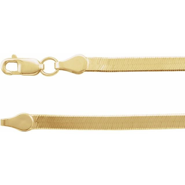 Detail of lobster clasp on solid 14k gold herringbone necklace.