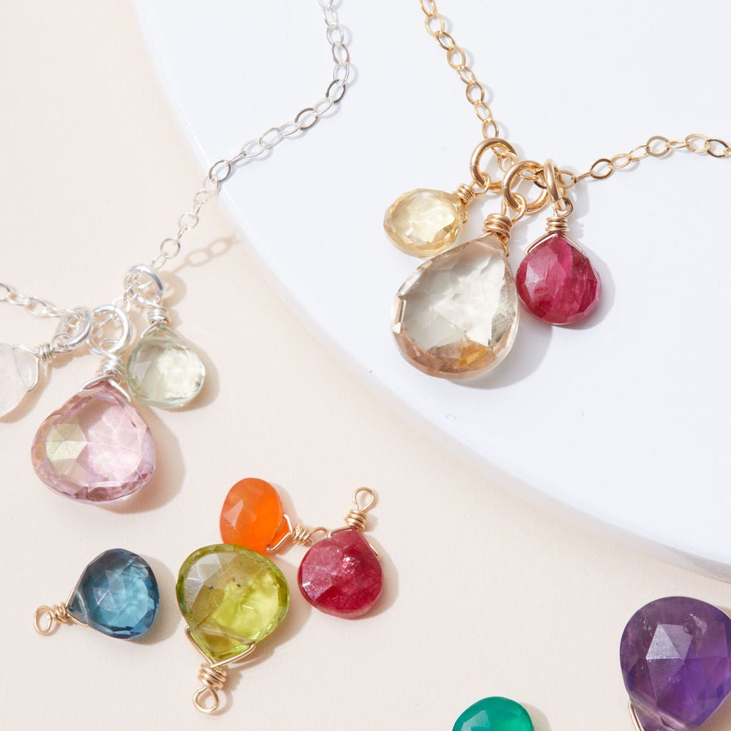 Gold pendant necklace with three hand-cut natural gemstones