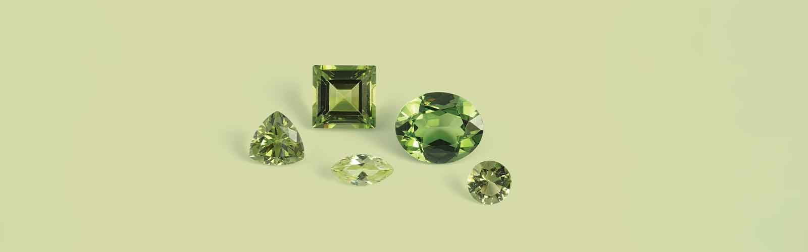 Peridot gemstones displayed to show how to properly care for peridot jewelry