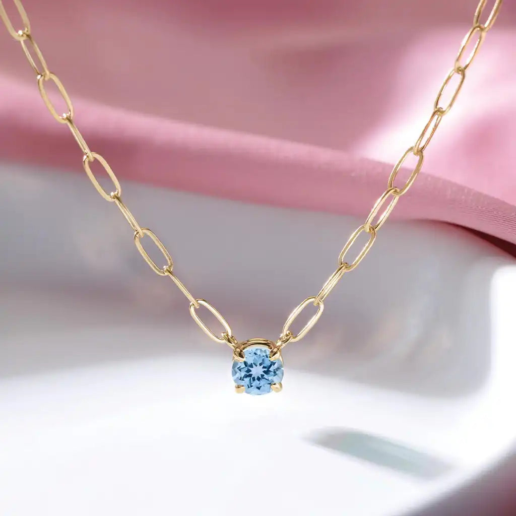 March birthstone jewelry featuring aquamarine in 14K gold