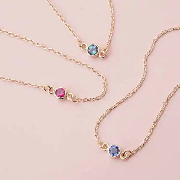 Handcrafted birthstone bracelet collection in 14K gold and sterling silver