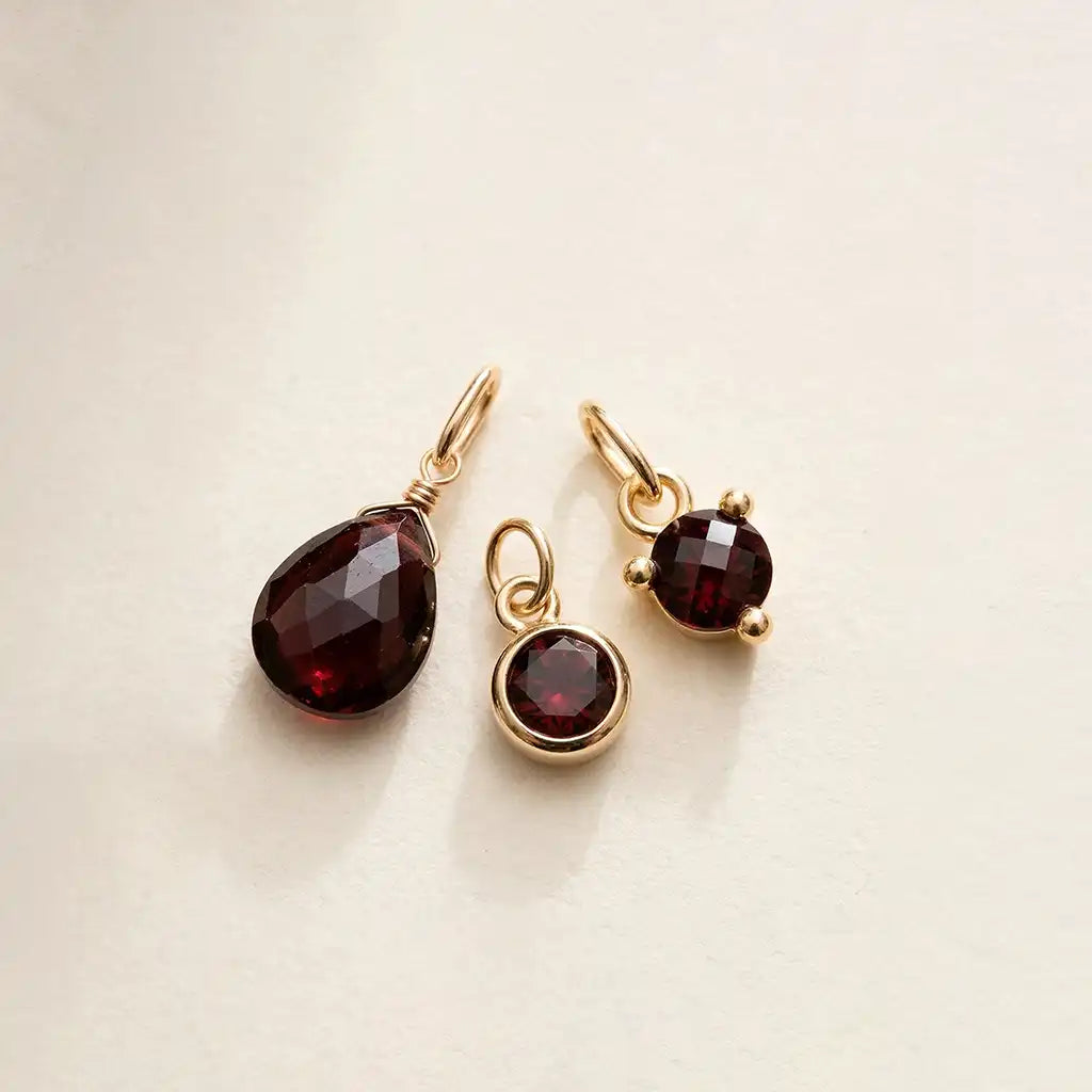 Garnet birthstone charm in 14K gold, bezel-set